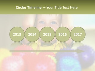 A Young Boy Is Holding His Head Above A Pile Of Balls PowerPoint Template