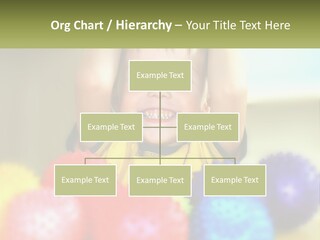 A Young Boy Is Holding His Head Above A Pile Of Balls PowerPoint Template