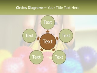 A Young Boy Is Holding His Head Above A Pile Of Balls PowerPoint Template