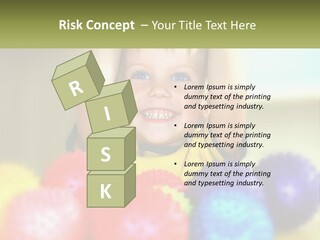 A Young Boy Is Holding His Head Above A Pile Of Balls PowerPoint Template