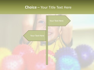 A Young Boy Is Holding His Head Above A Pile Of Balls PowerPoint Template