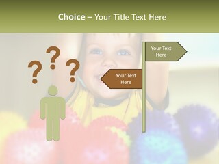 A Young Boy Is Holding His Head Above A Pile Of Balls PowerPoint Template