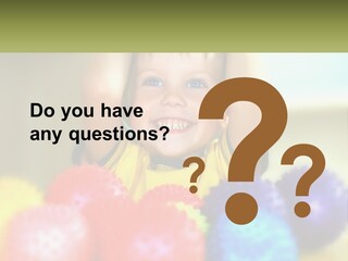 A Young Boy Is Holding His Head Above A Pile Of Balls PowerPoint Template