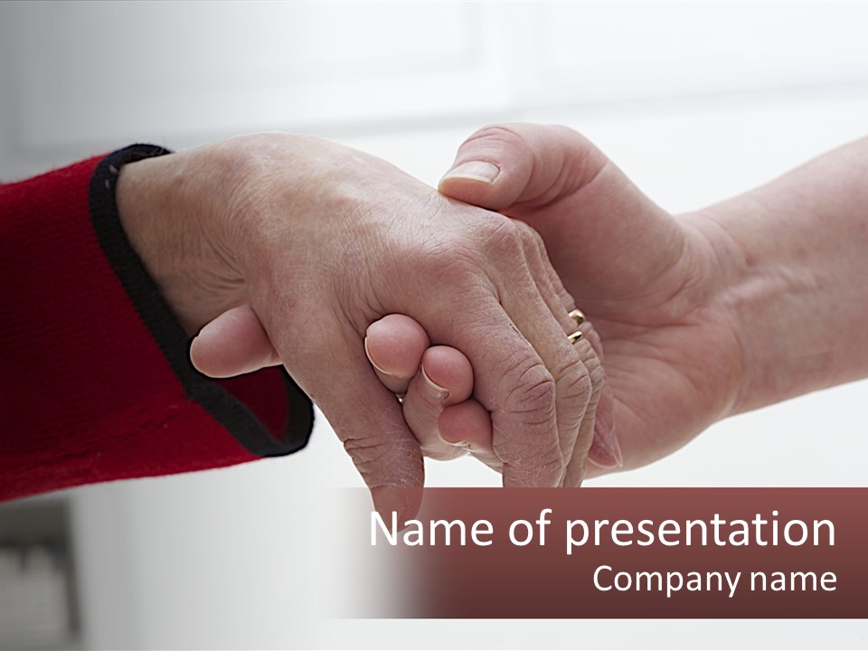 A Couple Of People Holding Hands Over A Table PowerPoint Template