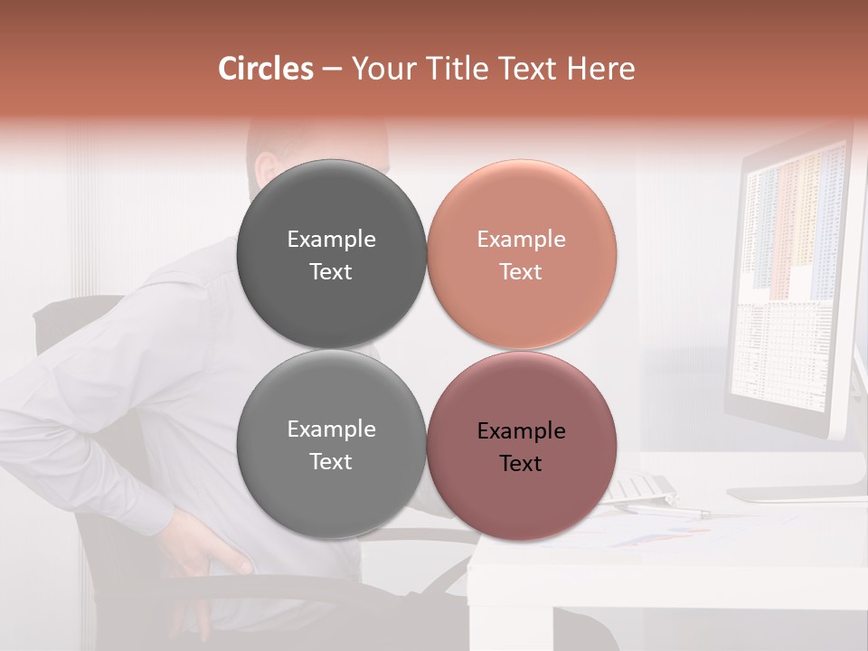 A Man Sitting At A Desk Using A Computer PowerPoint Template