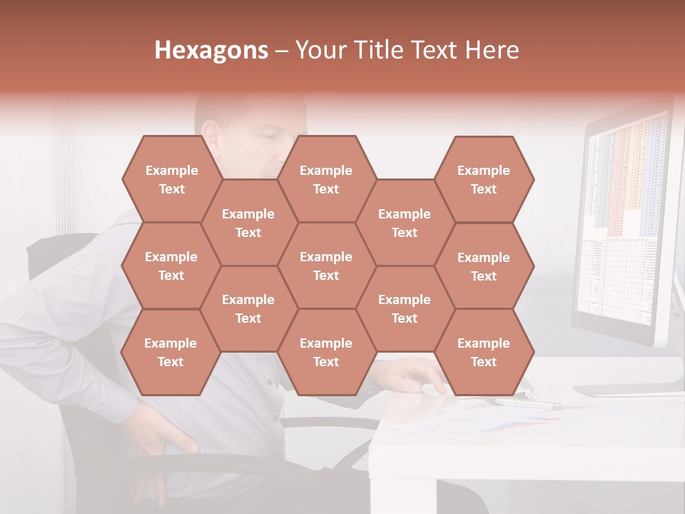 A Man Sitting At A Desk Using A Computer PowerPoint Template
