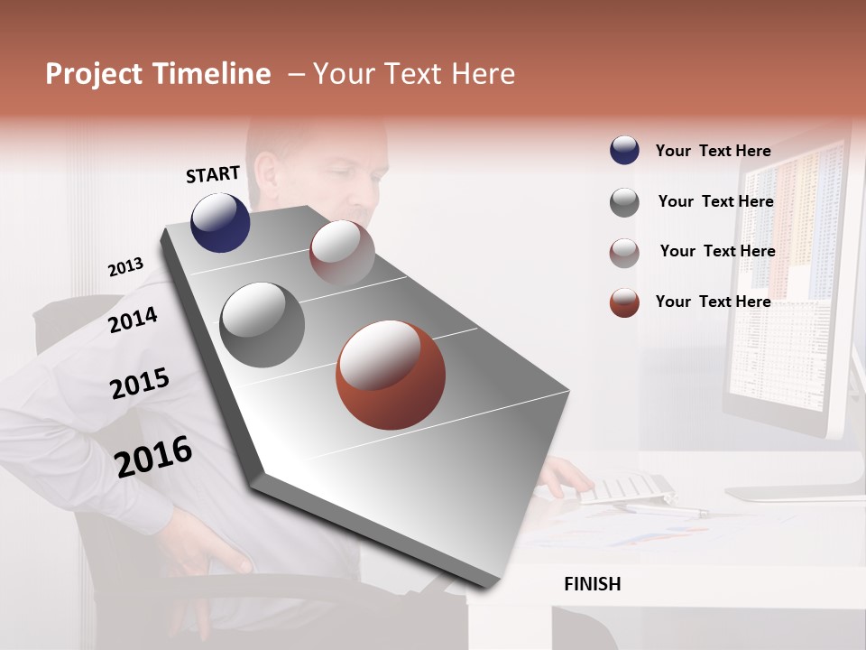 A Man Sitting At A Desk Using A Computer PowerPoint Template