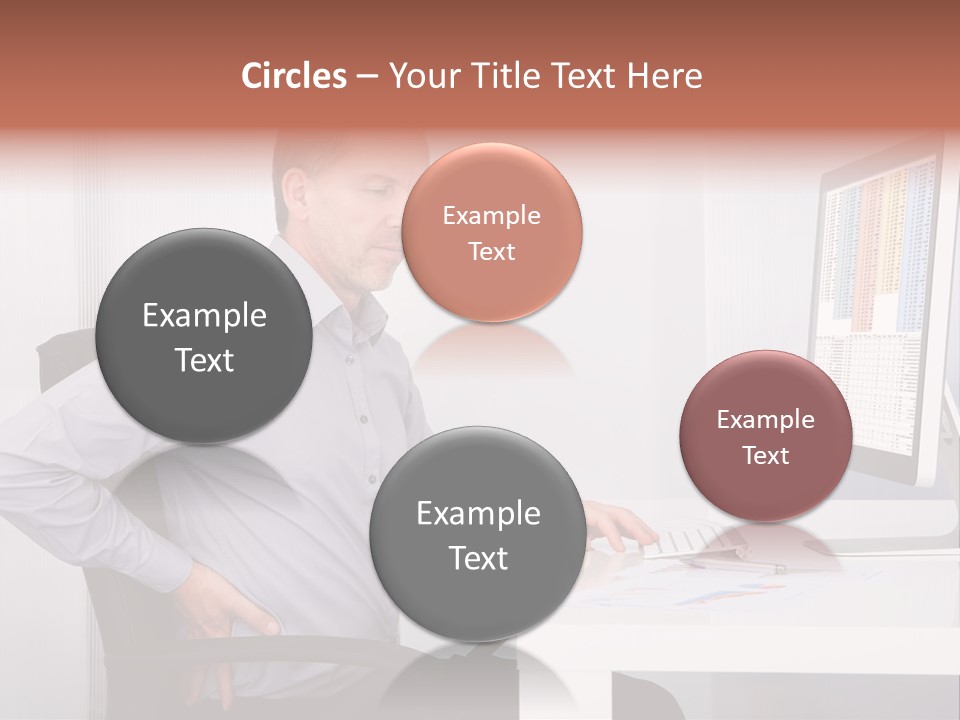 A Man Sitting At A Desk Using A Computer PowerPoint Template
