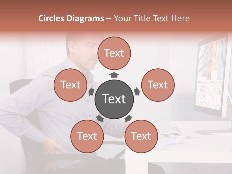 A Man Sitting At A Desk Using A Computer PowerPoint Template