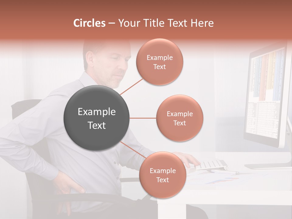 A Man Sitting At A Desk Using A Computer PowerPoint Template