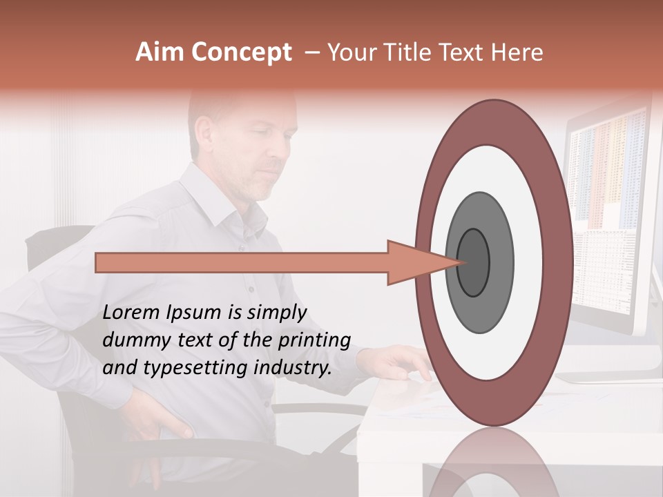 A Man Sitting At A Desk Using A Computer PowerPoint Template