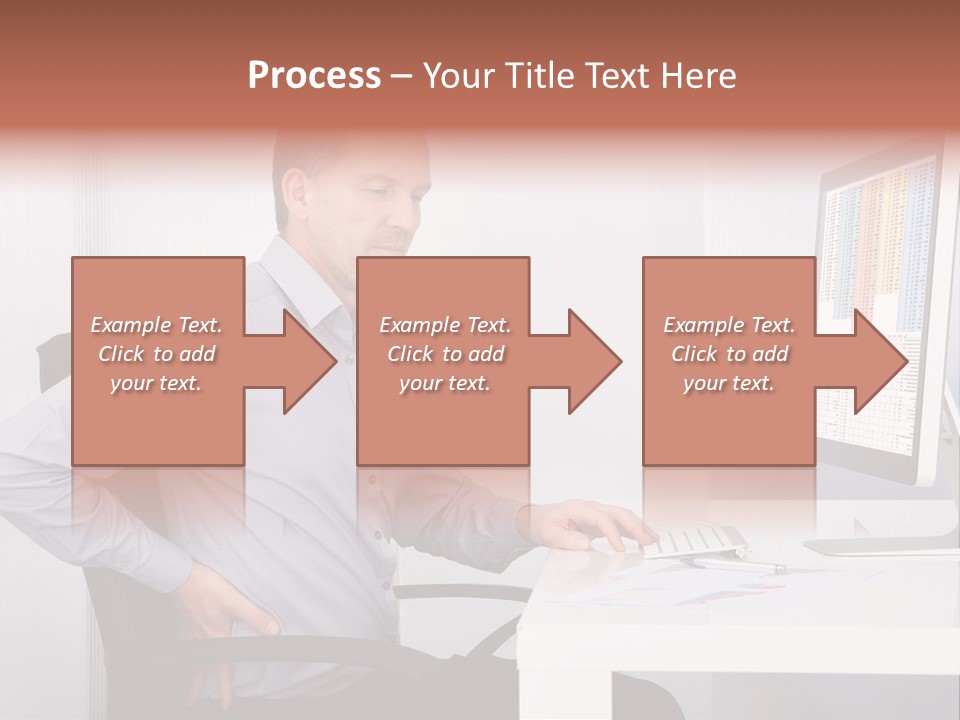 A Man Sitting At A Desk Using A Computer PowerPoint Template