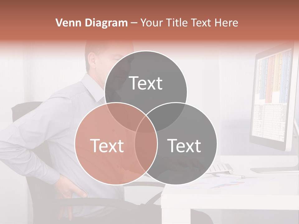 A Man Sitting At A Desk Using A Computer PowerPoint Template