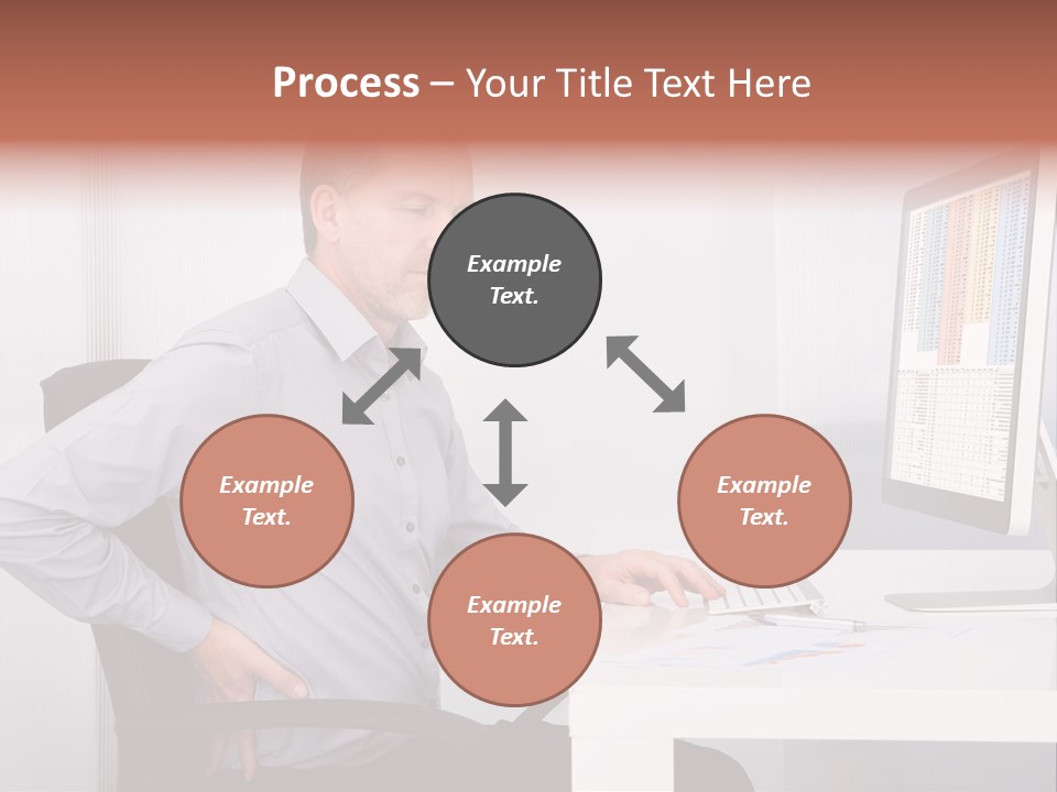 A Man Sitting At A Desk Using A Computer PowerPoint Template