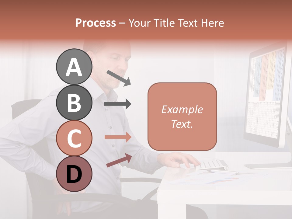 A Man Sitting At A Desk Using A Computer PowerPoint Template