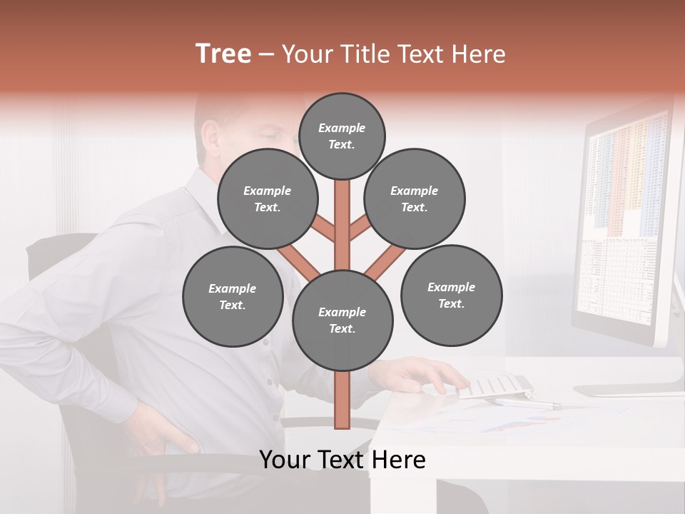 A Man Sitting At A Desk Using A Computer PowerPoint Template