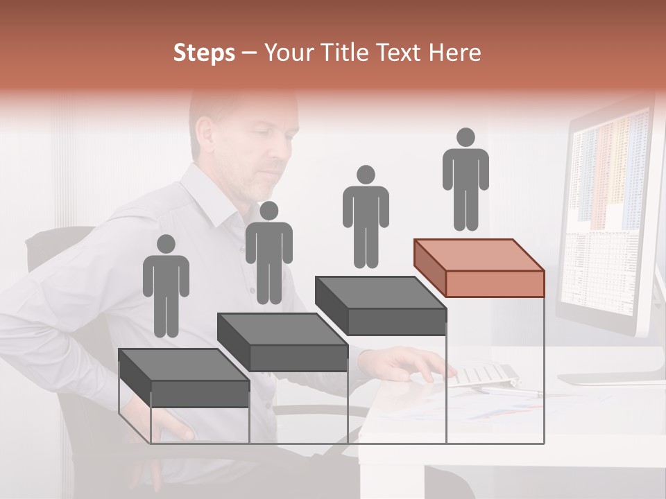 A Man Sitting At A Desk Using A Computer PowerPoint Template