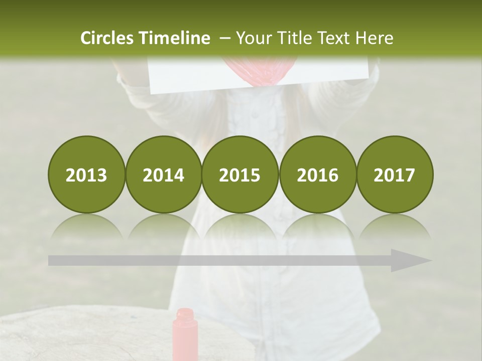 A Girl Holding A Piece Of Paper With A Heart Drawn On It PowerPoint Template