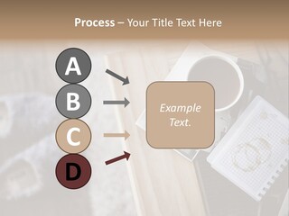 A Cup Of Coffee Sitting On Top Of A Wooden Table PowerPoint Template