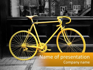 A Yellow Bicycle Parked On The Side Of A Building PowerPoint Template