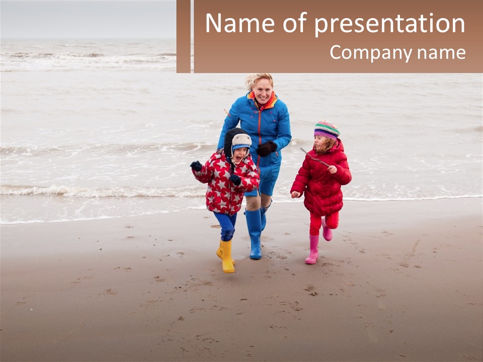 A Woman And Two Children Walking On The Beach PowerPoint Template