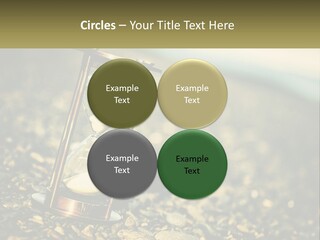 An Hourglass Sitting On Top Of A Pile Of Rocks PowerPoint Template