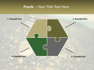 An Hourglass Sitting On Top Of A Pile Of Rocks PowerPoint Template