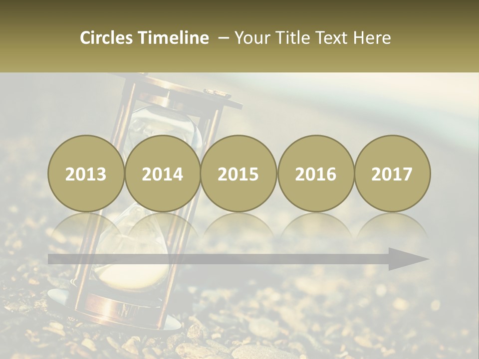An Hourglass Sitting On Top Of A Pile Of Rocks PowerPoint Template