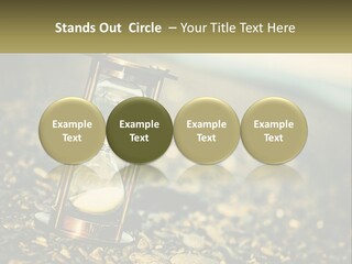 An Hourglass Sitting On Top Of A Pile Of Rocks PowerPoint Template