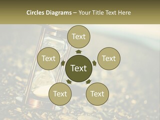 An Hourglass Sitting On Top Of A Pile Of Rocks PowerPoint Template