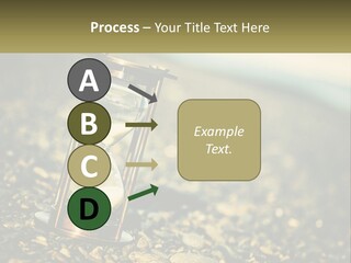 An Hourglass Sitting On Top Of A Pile Of Rocks PowerPoint Template