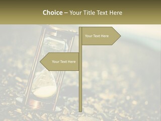 An Hourglass Sitting On Top Of A Pile Of Rocks PowerPoint Template