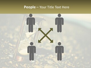 An Hourglass Sitting On Top Of A Pile Of Rocks PowerPoint Template