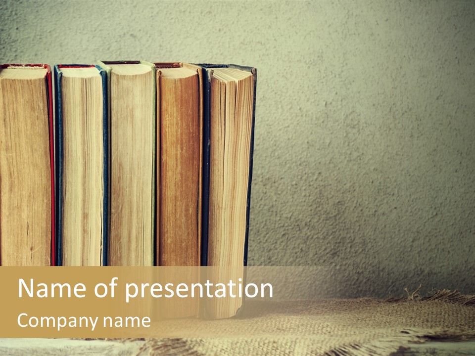 A Row Of Books Sitting On Top Of A Table PowerPoint Template