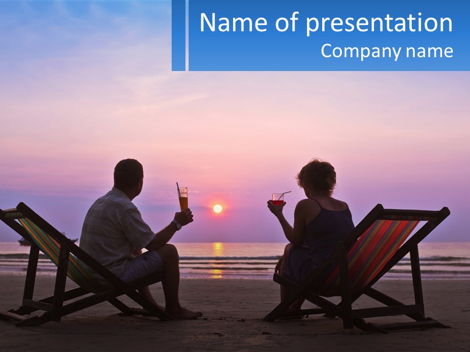 A Man And A Woman Sitting On Beach Chairs At Sunset PowerPoint Template