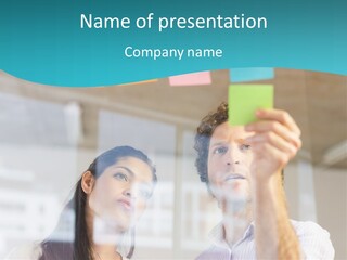 A Man And A Woman Are Looking At A Piece Of Paper PowerPoint Template