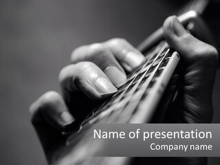 A Person Holding A Guitar String In Their Hands PowerPoint Template