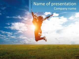 A Man Jumping In The Air With His Arms In The Air PowerPoint Template