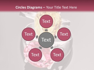 A Ring With A Yellow And Pink Stone On It PowerPoint Template