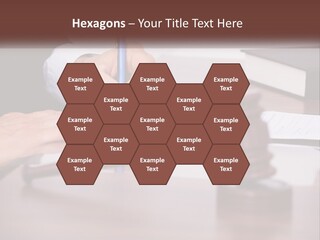 A Person Signing A Document On A Desk PowerPoint Template