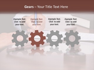 A Person Signing A Document On A Desk PowerPoint Template