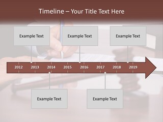 A Person Signing A Document On A Desk PowerPoint Template