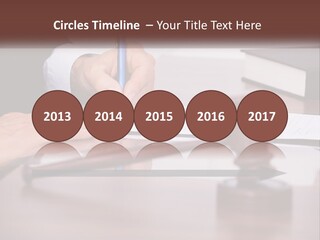 A Person Signing A Document On A Desk PowerPoint Template