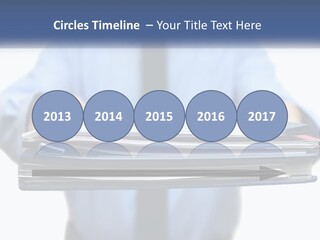 A Man Holding A Stack Of Files In His Hands PowerPoint Template