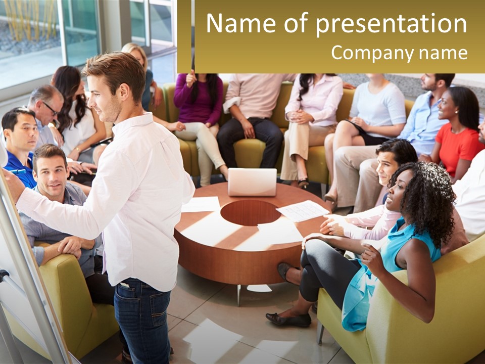 A Man Standing In Front Of A Group Of People PowerPoint Template