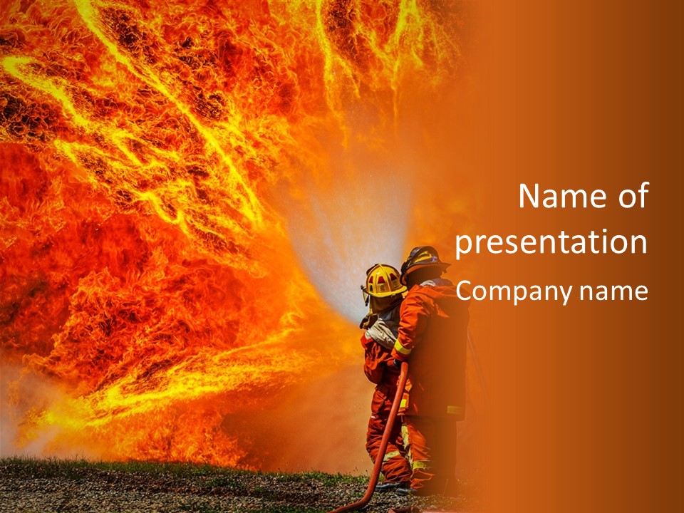 A Firefighter Standing In Front Of A Large Fire PowerPoint Template