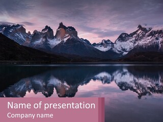 A Mountain Range Is Reflected In The Water Of A Lake PowerPoint Template