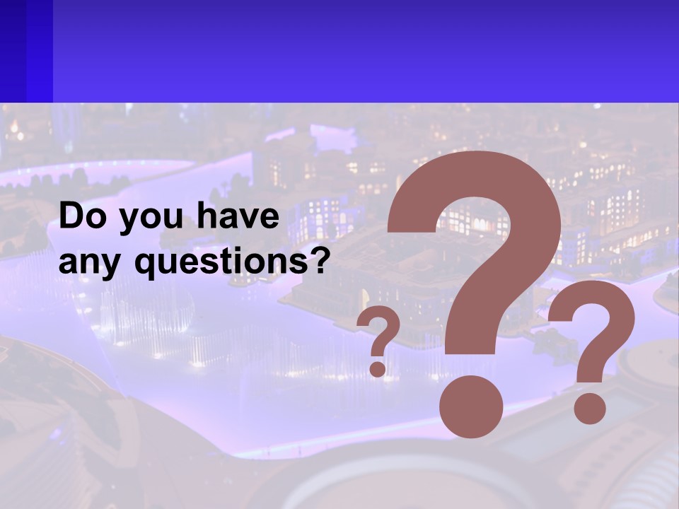 A Model Of A City At Night With A Fountain PowerPoint Template