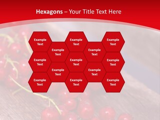 A Bunch Of Red Berries Sitting On Top Of A Wooden Table PowerPoint Template