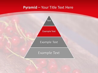A Bunch Of Red Berries Sitting On Top Of A Wooden Table PowerPoint Template